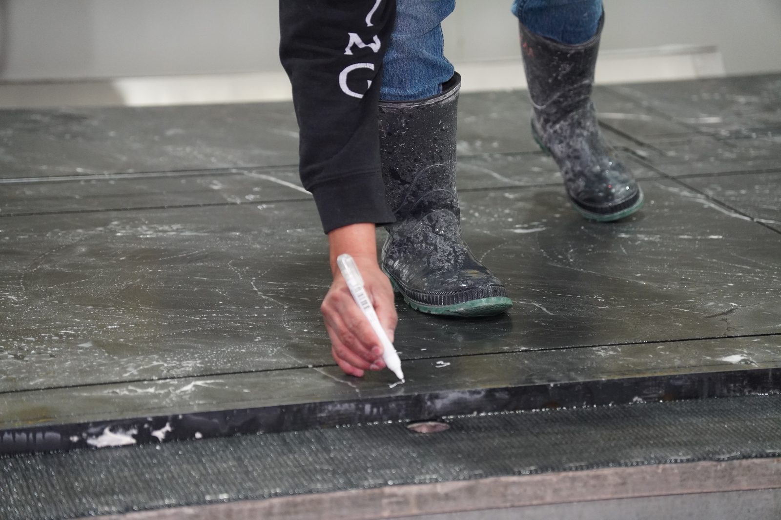Prime Countertops craftsman finishing a stone countertop edge by hand